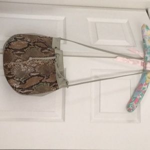 Cute little light beige gray purse with snake print on the front